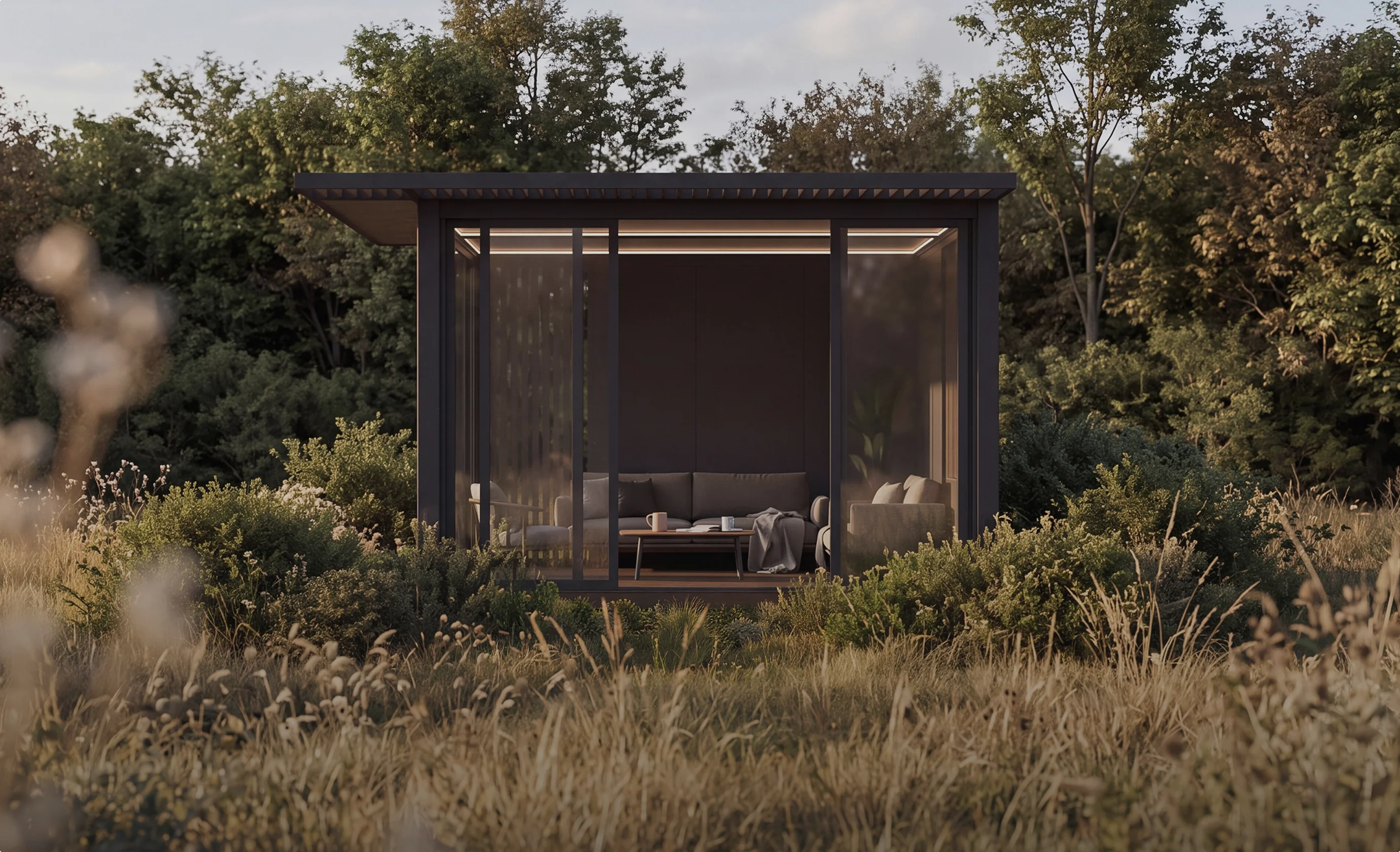 The completed OS1 pavilion surrounded by trees and autumn grasses